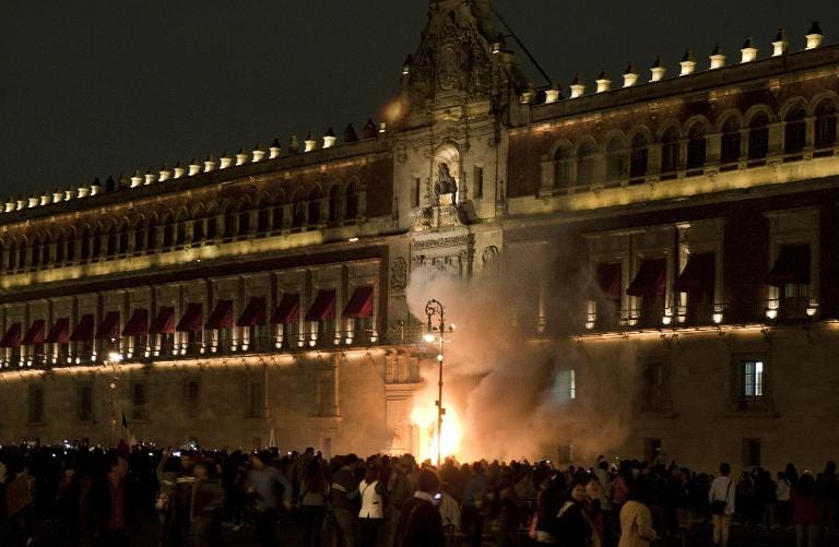 afp-protesters-try-to-break-into-mexico-citys-national-palace.jpg