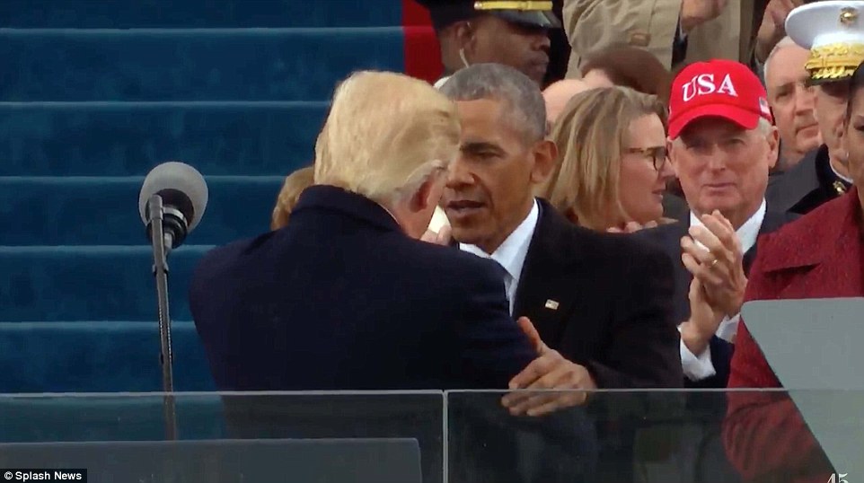 3C54CC3F00000578-4140672-Obama_and_Trump_shake_hands_and_have_a_semi_embrace_after_Trump_-a-90_1484945389001.jpg